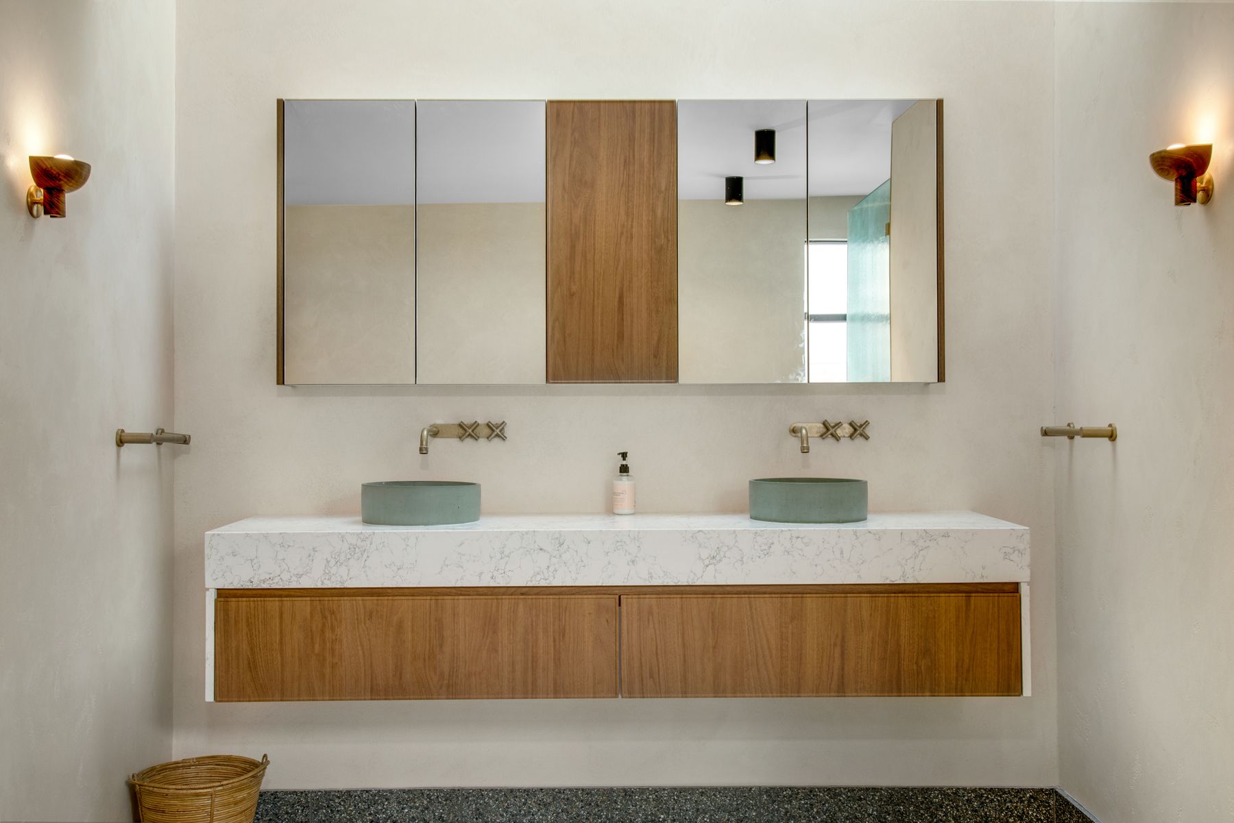 A bathroom vanity with twin mirrors and fitted joinery from a completed project